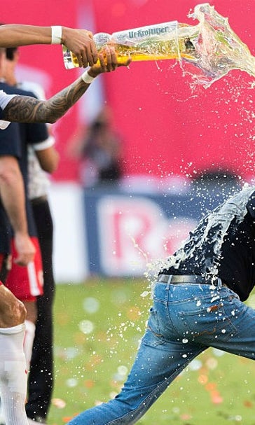 Leipzig head coach pulls hamstring trying to avoid beer shower
